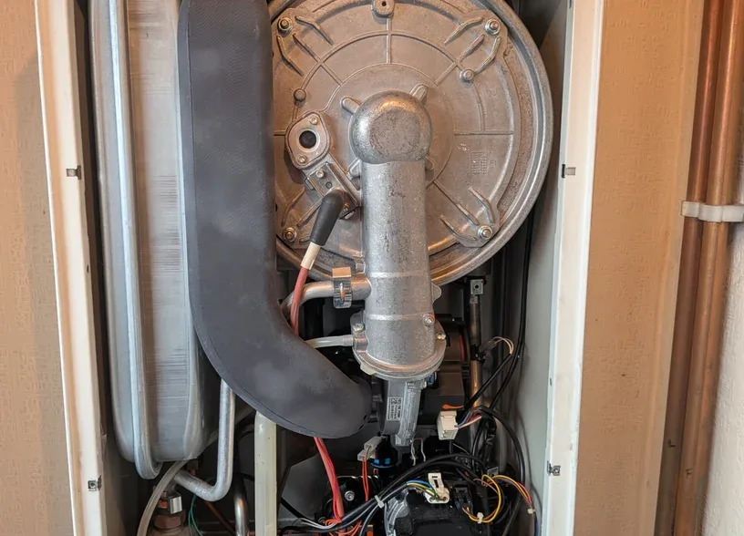 Burner and fan assembly inside a boiler